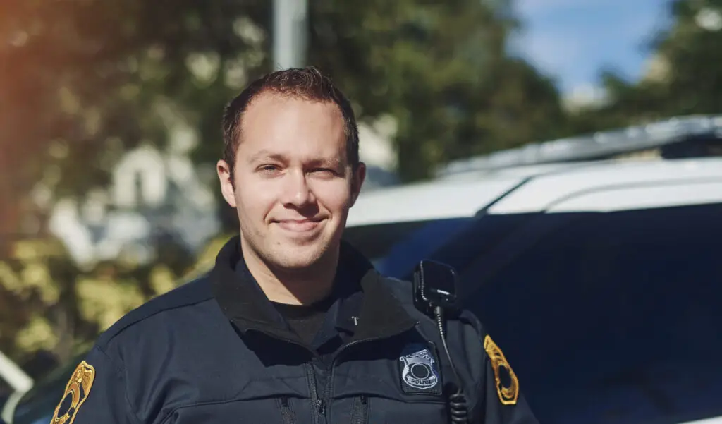 Police standing in front of car
